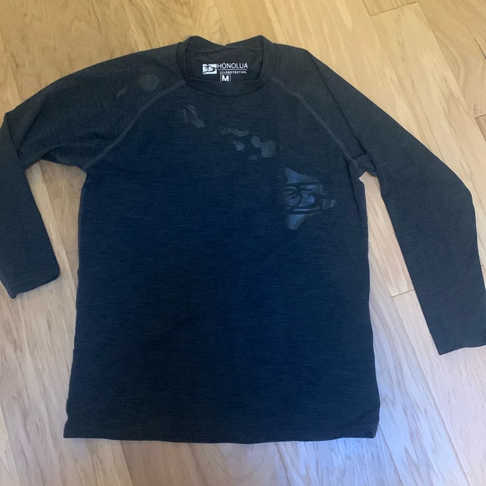 Like new.  Long sleeve rash guard.  SPF 20 sun protection.